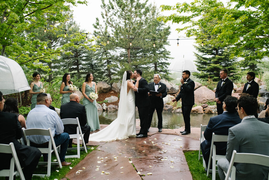Bride and groom exchanging kisses during a Greenbriar Inn wedding ceremony.