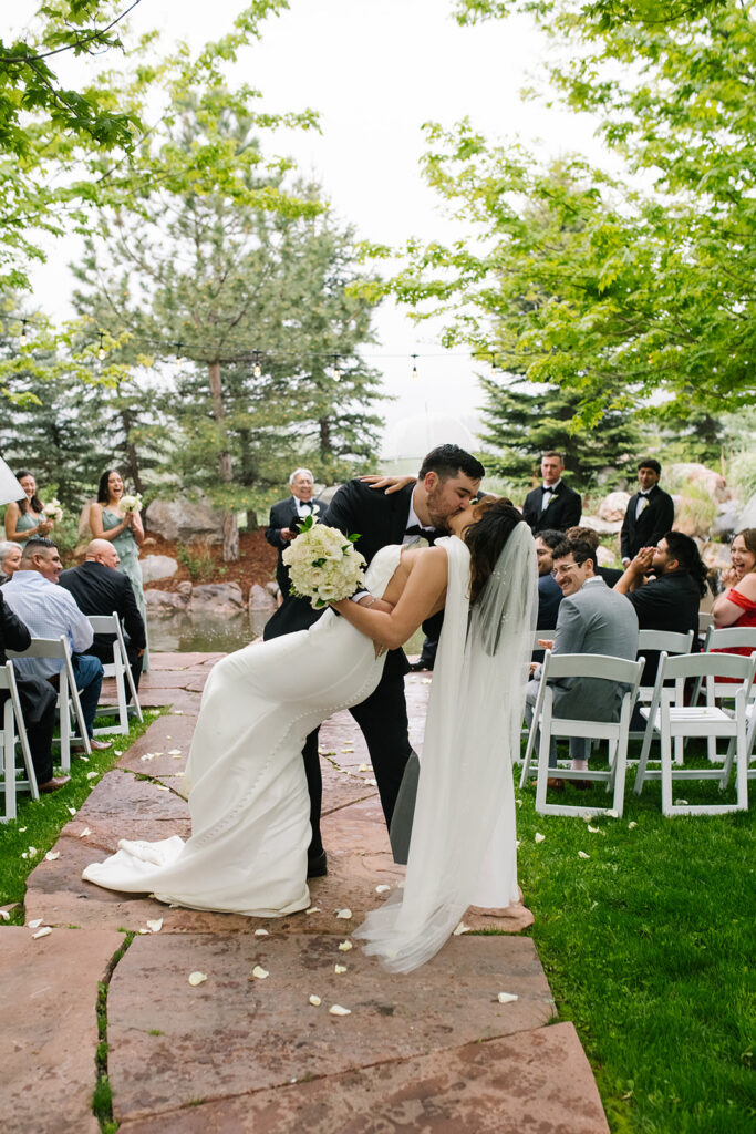 Bride and groom exchanging kisses during a Greenbriar Inn wedding ceremony.
