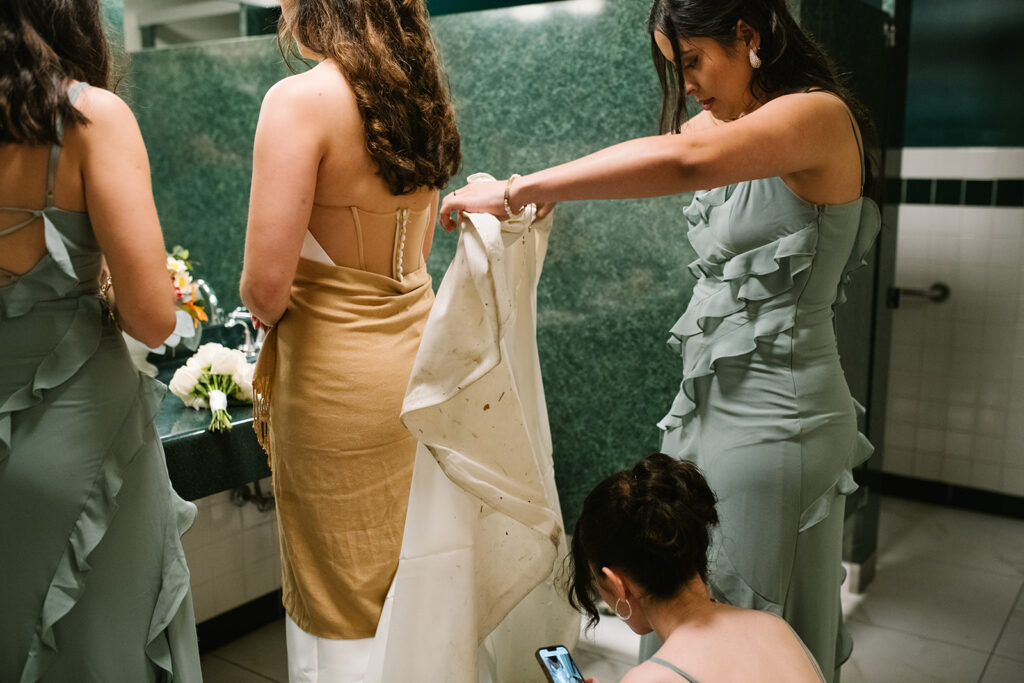 candid moment of the bride and bridemaids in green briar inn wedding 