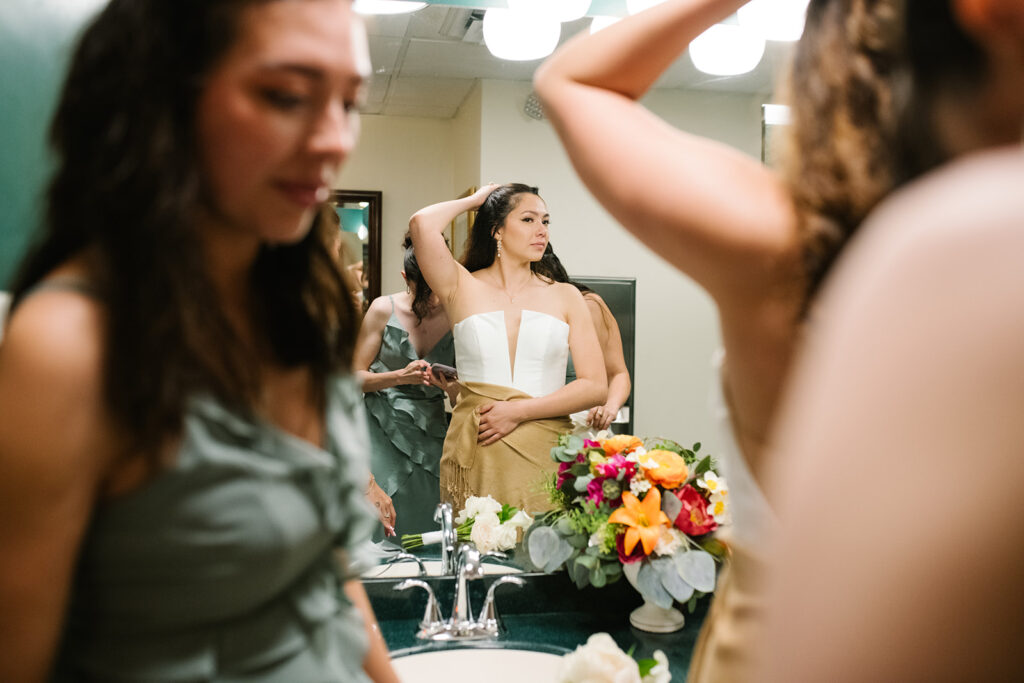 candid moment of the bride and bridemaids in green briar inn wedding 