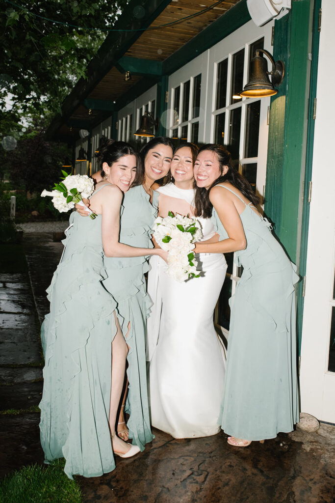 candid moment of the bride and bridemaids in green briar inn wedding 