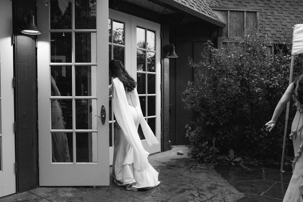 documentary and candid moment of the bride during a rainy spring wedding at the greenbriar inn wedding venue