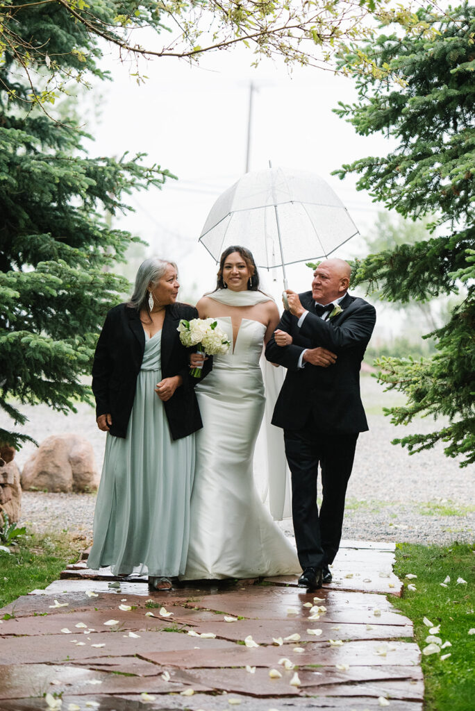 Rainy spring Greenbriar Inn wedding ceremony at Greenbriar Falls in boulder colorado