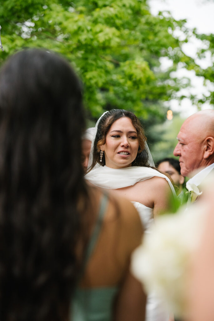 bride walking down the aisle at Greenbriar Falls wedding venue in boulder colorado