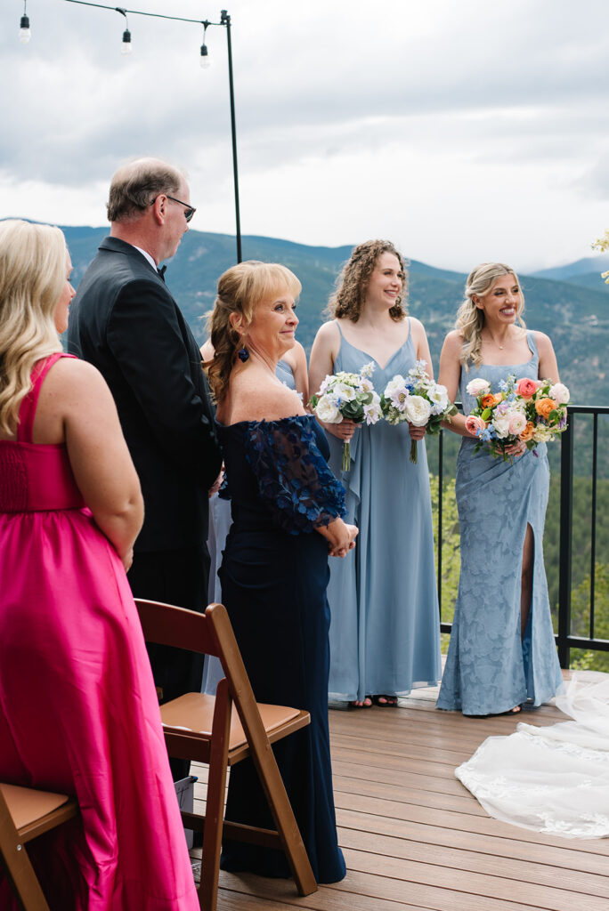 Emotional guest wiping away tears during North Star Gatherings wedding ceremony.