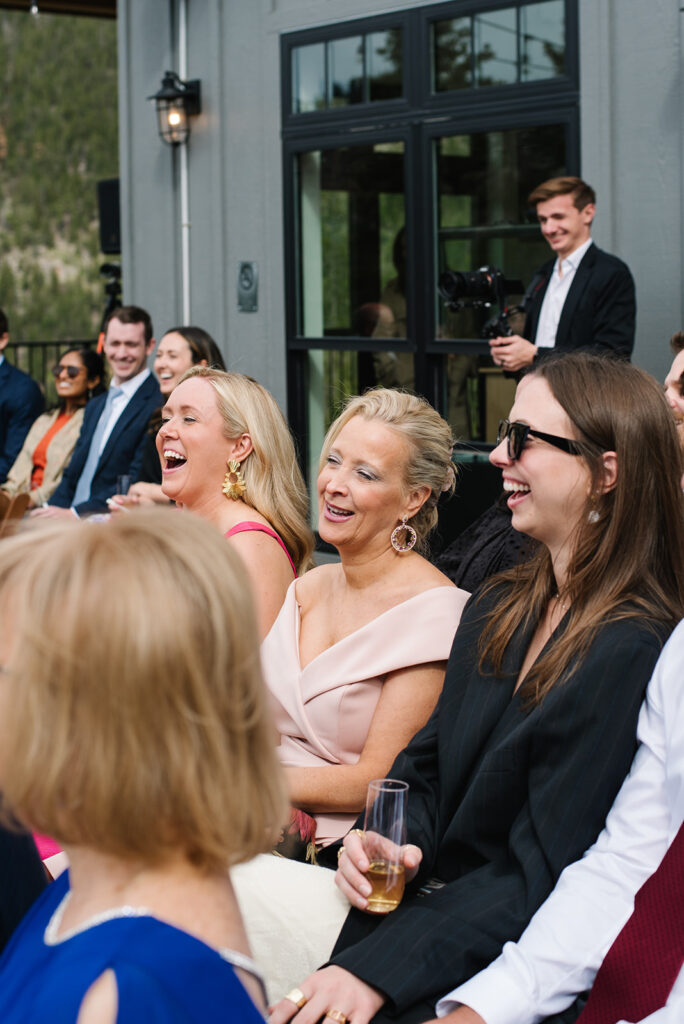 Guests watching the ceremony on the deck at North Star Gatherings wedding.