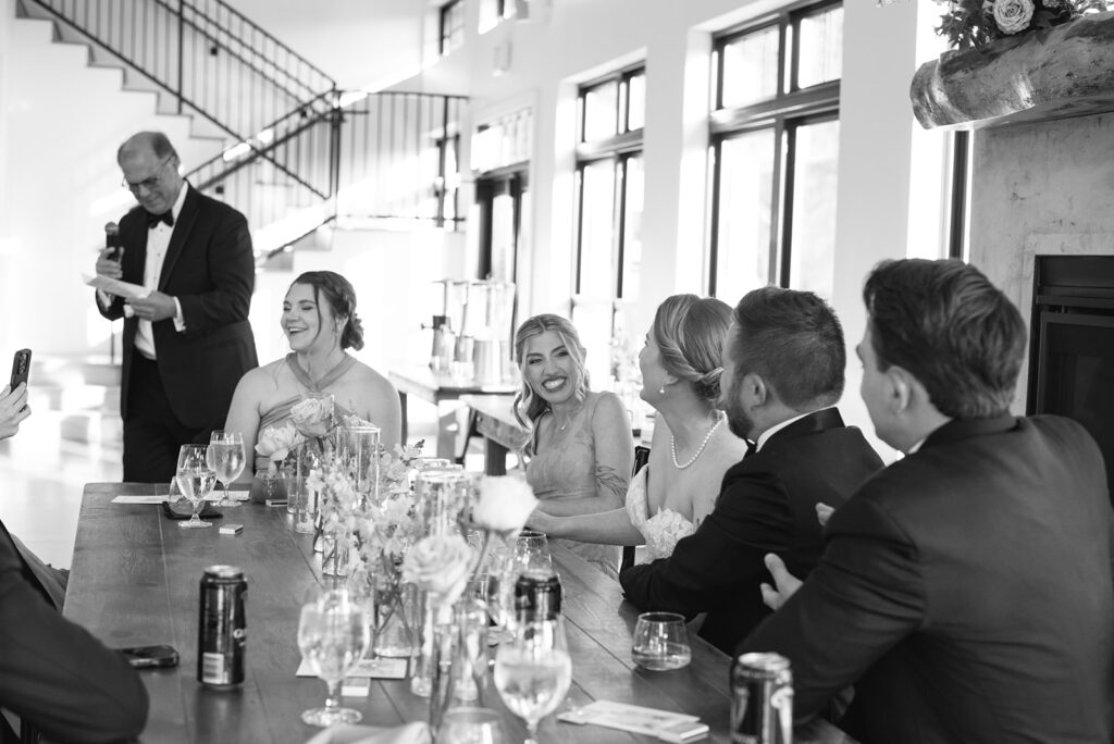 Candid laughter between friends during North Star Gatherings cocktail hour.