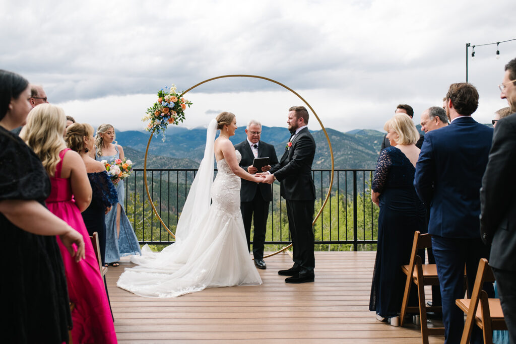 Couple exchanging vows with mountain views at North Star Gatherings wedding.