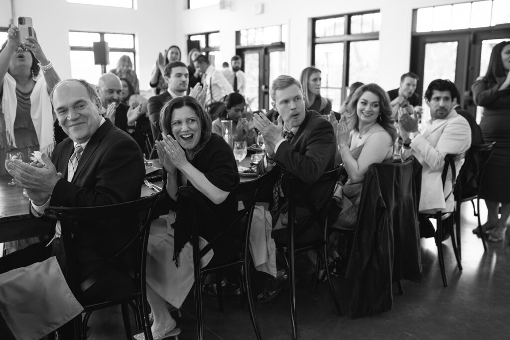 Candid laughter between friends during North Star Gatherings cocktail hour.