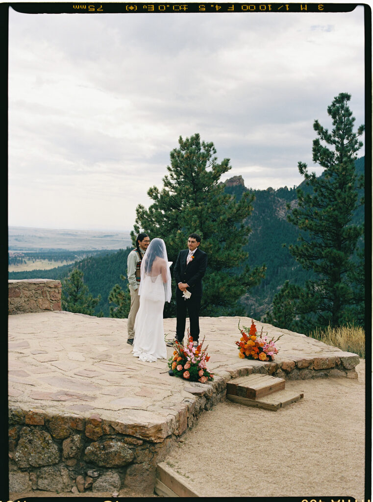 Sunrise Amphitheater wedding ceremony in Boulder Colorado from a colorado film wedding photographer