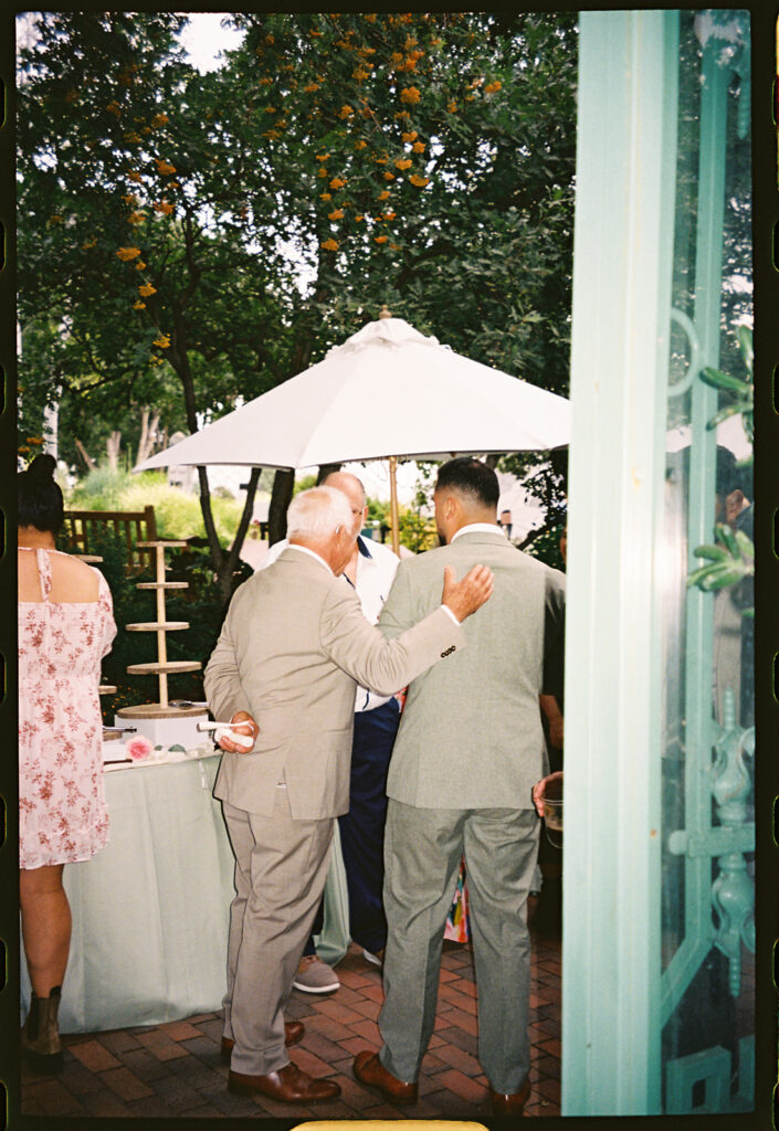 candid reception moments at the Denver Botanic Gardens Wedding inside the Mosaic Solarium