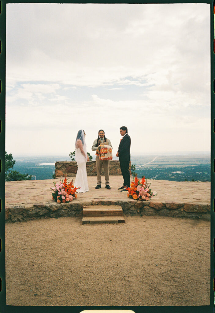 Sunrise Amphitheater wedding ceremony in Boulder Colorado from a colorado film wedding photographer