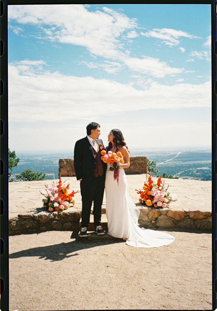 Sunrise Amphitheater wedding ceremony in Boulder Colorado from a colorado film wedding photographer