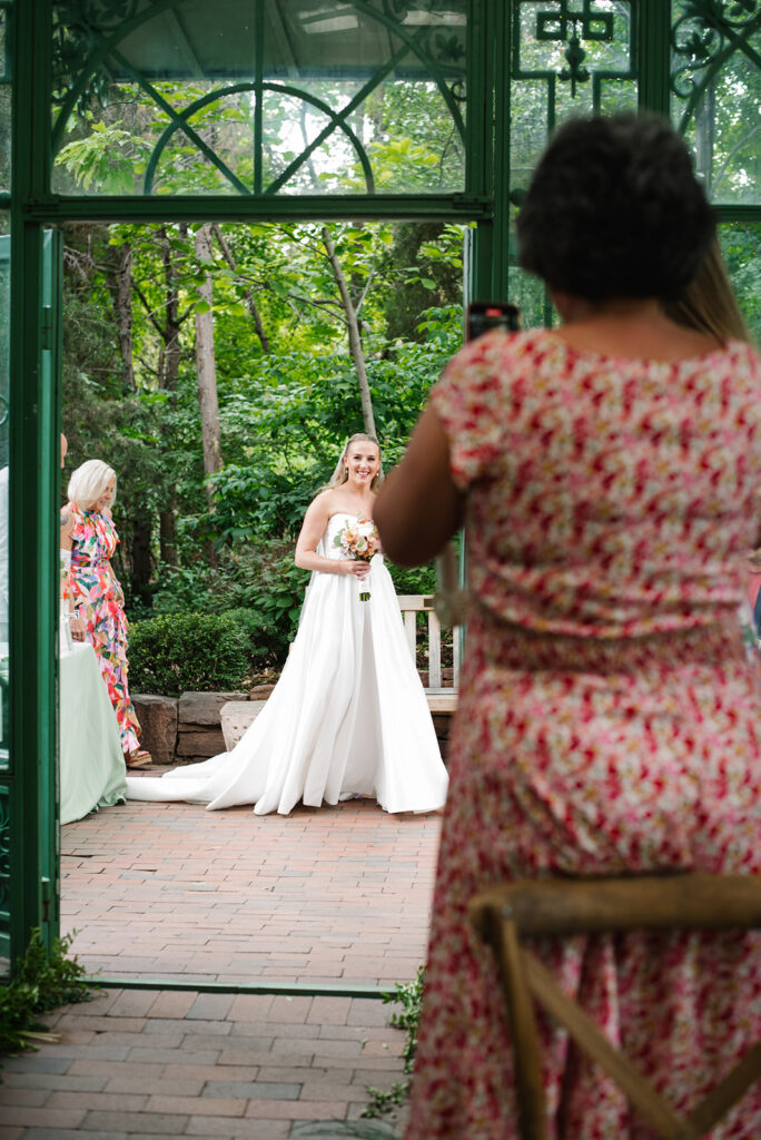 A ceremony taking place at the Mosaic Solarium in the Denver Botanic Gardens