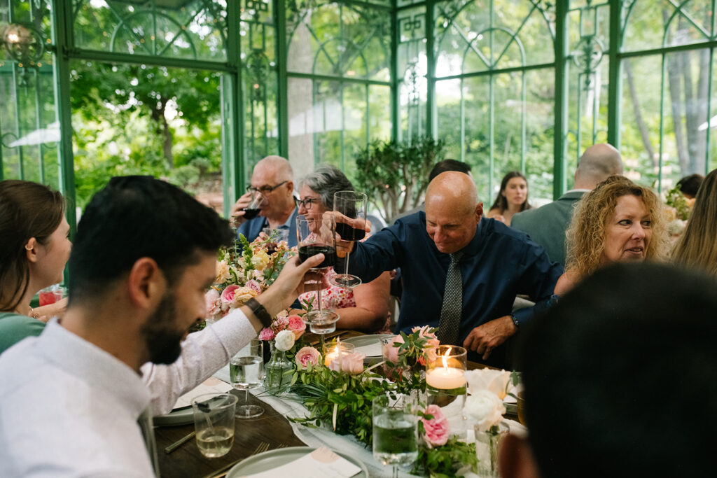 candid reception moments at the Denver Botanic Gardens Wedding inside the Mosaic Solarium