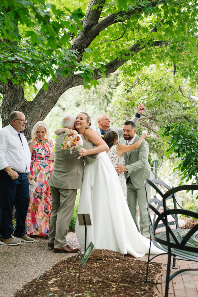 documentary wedding photographs of cocktail hour at the denver botancial gardens